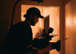 What is the best way to organise public film screenings for small communities, including legal permissions, venue selection, and promotion?